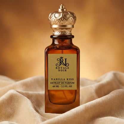 Perfume bottle labeled 'Royale Noir Vanilla Kiss' on a soft fabric background